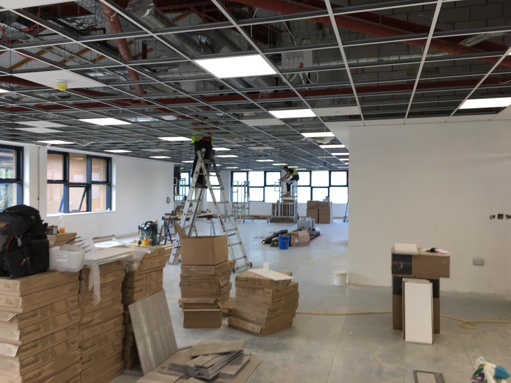 work team working on a suspended ceiling